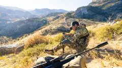 medium_cropped_wide-public-content-images-2024-01-burris_signature_hd_spotting_scope_man_glassing_hillside_.webp.png
